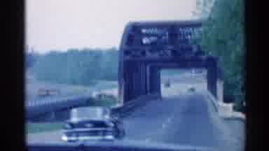 Indiana (1959): View Father On Windshield Of Car Sets With Bridge And Cuts To Rod