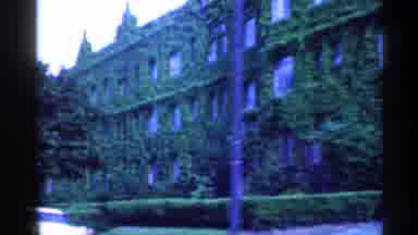 Indiana (1959): Vintage Buildings Covered In Vines Driving Behind Model Car