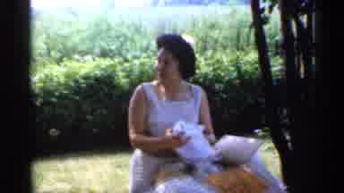 Indiana (1959): Pretty Woman Wearing Cute Dress Unwrapping Glass Out Of Box While