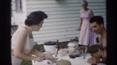 Indiana (1959): Woman Bout To Cut Cake While Man Lens Up Table Round Her
