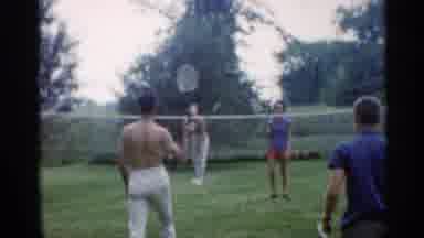 Indiana (1959): Four Adults Playing Badminton In Backyard Having Fun Times
