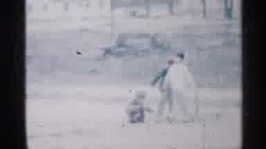 Indiana (1959): Children Play Outside In Dirt While Man Sits On Couch In Living