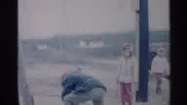 Indiana (1959): Kids Outside In Snow Ger Bent Over And Digging In Snow Like
