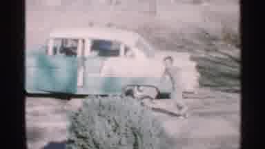 Indiana (1959): Young Child Excitedly Runs Father On Vehicle While Deming
