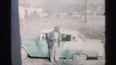 Indiana (1959): People Walking Into House With Gs And Man Icing Outside Of House