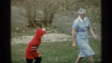 Indiana (1959): Grandma Playing With Her Grandchild Running Round In Grass