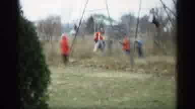 Indiana (1959): Children Wearing Coats Playing Outside On Swing Set One Child Is