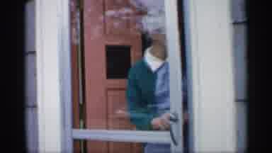 Indiana (1959): Old Woman Walking Out Of Her Home While Seeing And Inspecting Her