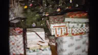 Indiana (1959): Nelly Wrapped Gifts Sitting Bent Over Decorated Christmas Tree In