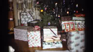 Indiana (1959): Boy Carrying Puppy Sits In Father Of Christmas Tree Surrounded By