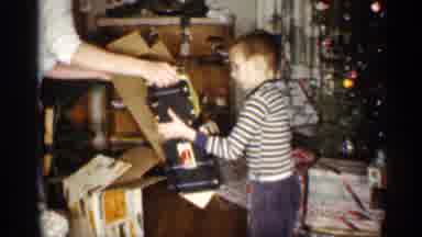 Indiana (1959): Helpful Parents Help Son Unwrap Cement Toy Truck Motherly