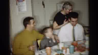 Indiana (1959): Family Of Six Eating Dinner At Table Older Lady Kisses Young Man A