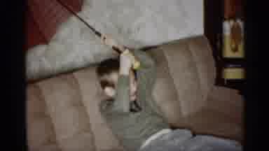 Indiana (1959): Child Sitting On Couch Holding Open Umbrella Grandmothers While