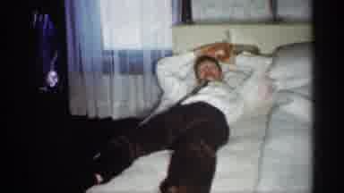 Indiana (1959): Man Trying To Sleep On Bed While Little Boy Walks Round Bed And