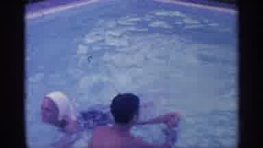 Indiana (1959): People Swimming Father On Pool Edge To Edge With Inflatables