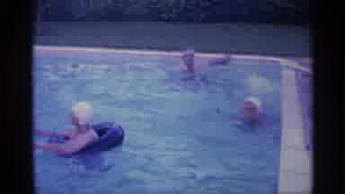 Indiana (1959): Woman Wearing White Swim Paddles In Pool With Black Inflatable