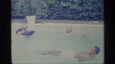 Indiana (1959): People Swimming In Pool S One Enjoys Pool In Floating Ring
