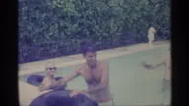 Indiana (1959): Man Wearing White Shooter Dives Underwater In Pool On Bright Sunny