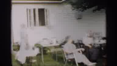 Indiana (1959): In Home Garden Group Of People Enjoy Sunny Day While Smiling Man