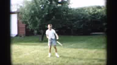 Indiana (1959): Boy Playing Badminton And Dogs Are Watching