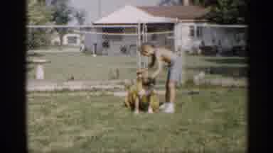 Indiana (1959): Boy Putting His Dogs In His Backyard On Hot Sunny Day