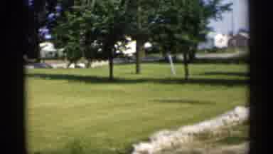 Indiana (1959): Rocks Line Gravel Driveway That Is Surrounded By Plush Lawn Bushes