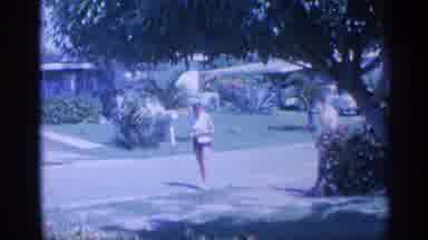 Indiana (1959): Man And Woman Walking Down Neighborhood Street