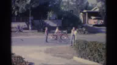 Indiana (1959): People Trending Family Picnic And Children Riding Bikes On Street