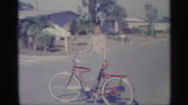 Indiana (1959): Boy With Bicycle In Street With Kickstand Down Car And Houses Seen
