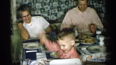 Michigan (1959): Man Drinks Glass Of Milk At Table While Boy Eves At Comer