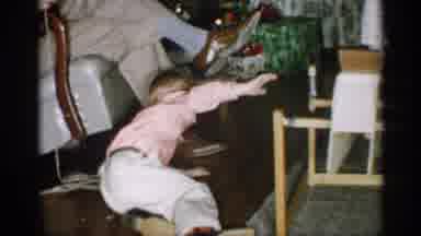 Michigan (1959): Young Boy Playing On Flo Other Standing To Play With Toys