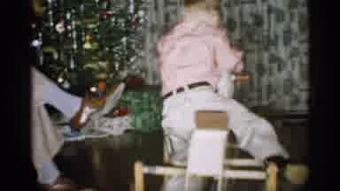 Michigan (1959): Kid Riding Rocking Toy Next To Christi's Tree A Adult Viewed