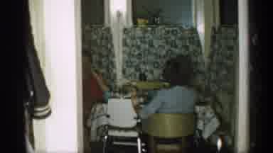 Michigan (1959): Two Women Sitting Smoking And Child Opening Gift Excitedly
