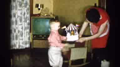 Michigan (1959): Woman Places Cake Other Music Carousel On Flo Other Father Little