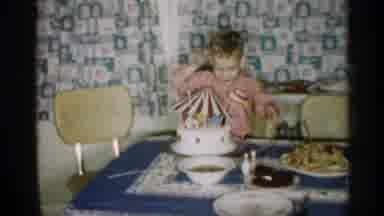 Michigan (1959): Small Male Child Pulling Flags Out Of Dish That Is In Father Of