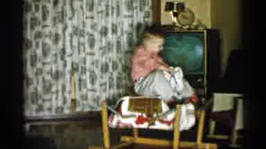 Michigan (1959): Kid Playing With Toy Horse In Living Room