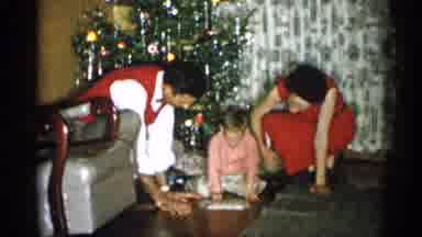 Michigan (1959): Mom And Dad With Kid Playing With Her Toy Near A Christmas