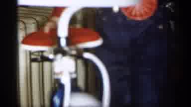Michigan (1959): Little Kid With Overfills Getting On Bike