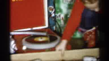 Michigan (1959): Child Opening Christmas Present