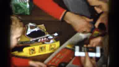 Michigan (1959): Kid Opening Present As Mom And Dad Help