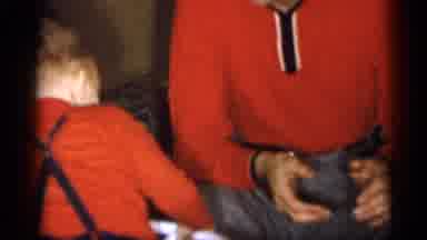 Michigan (1959): Father And Son Playing While Son Rides Scooter