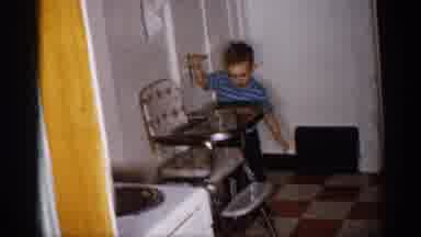 Michigan (1959): Child Opening Do Other And Walking Round Mir Assembling Toy Train