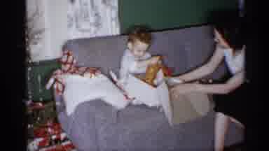 Michigan (1959): Child Sitting On Of Opening Christmas Gift With A Adult