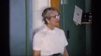 Michigan (1959): Elder Woman Sand And Looks On Small Child Plays On Rocking