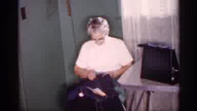 Michigan (1959): A Drunk Man Holding A Bottle Waves To The Camera - An Old Lady