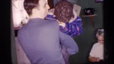Michigan (1959): Man Holds And Interacts With Child Then Cuckoo Clock Is Shown On