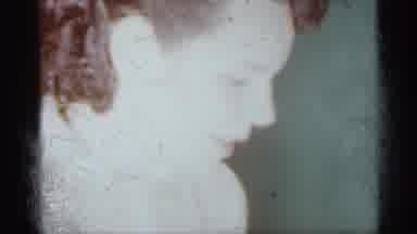 Michigan (1959): A Woman In A Beige Coat Waving Goodbye And Felting A Family