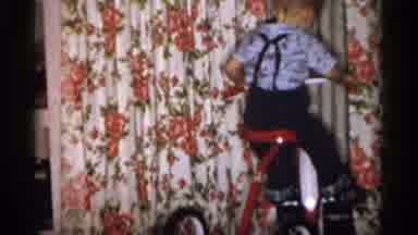 Michigan (1959): Boy Rides Tricycle Indoors Then Adults Look Around And Interact