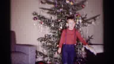 Michigan (1959): Boy In Suspenders Waving At Camera In Front Of Christmas Tree