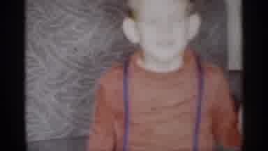 Michigan (1959): Child Eyes Close While Mom Cleans Dishes